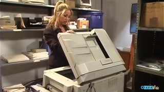 Instead of fixing the photocopier the maintenance guy pummels the busty blonde Asian Kianna Dior.